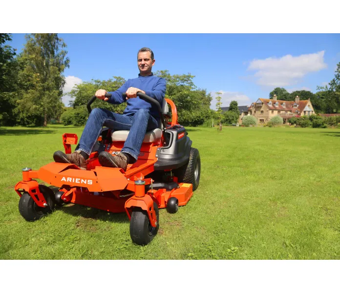 ariens ikon xd zero turn cutting grass on lawn scaled kuva